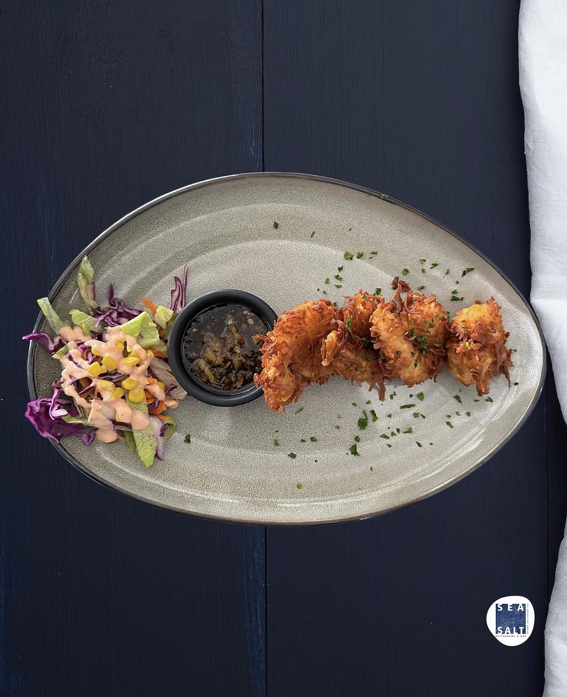 Coconut fried shrimp with slaw and spicy dip at Sea Salt