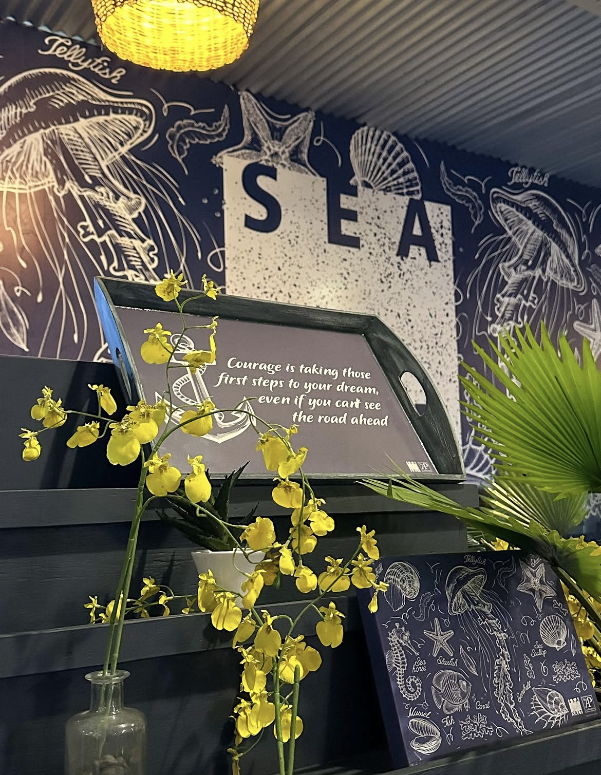 Jellyfish mural wall with an anchor tray and yellow orchids