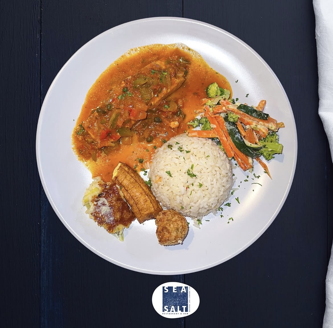 Creole fish with rice, plantain and vegetables