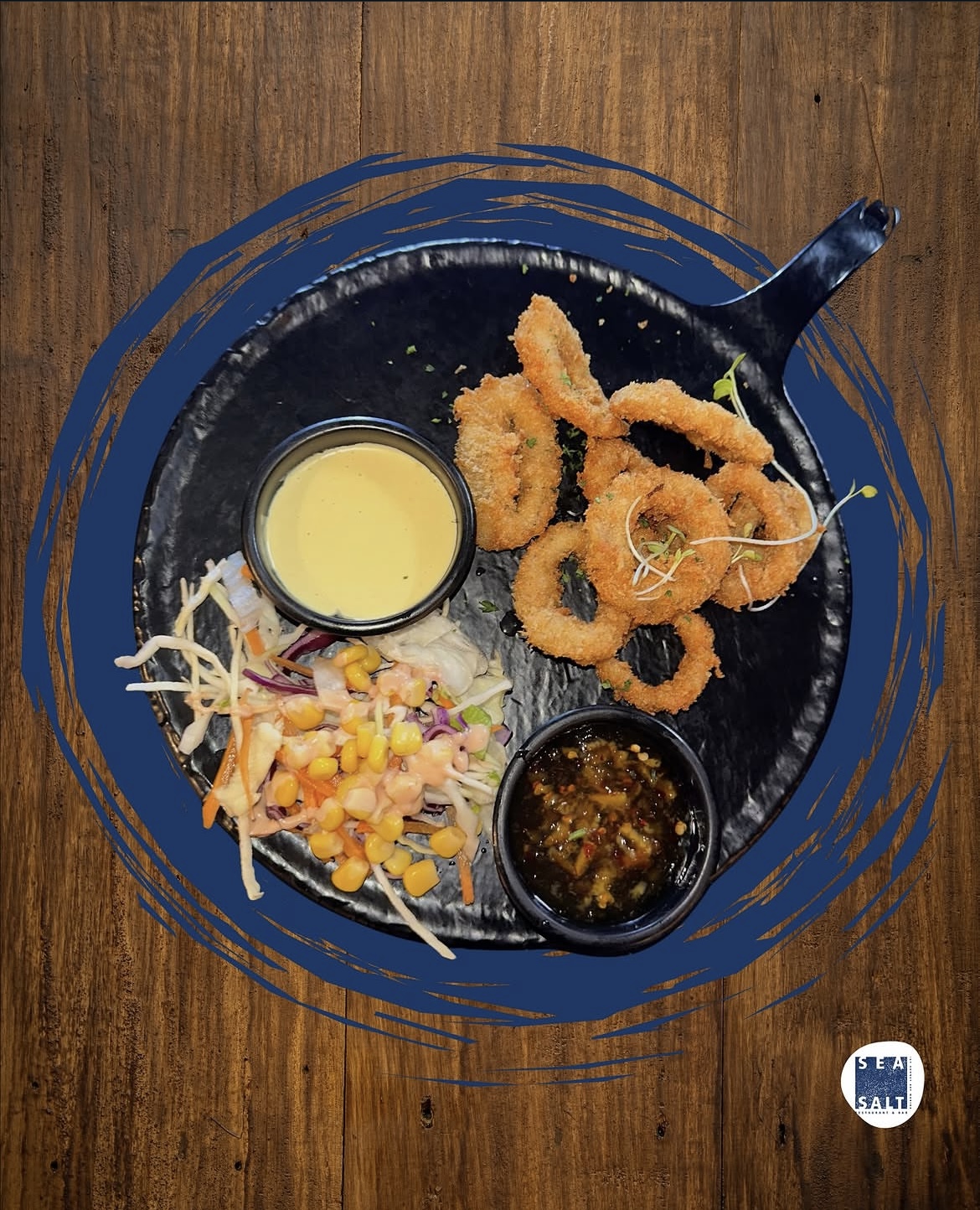 Crispy calamari rings with slaw and two dipping sauces